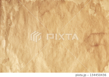 Weathered kraft parchment with visible brown stains Weathered kraft parchment with visible brown stains 134450436