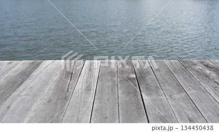 weathered wooden planks with river view weathered wooden planks with river view 134450438