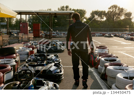 Man preparing for race day at the GoKart track for an exhilarating experience 134450475