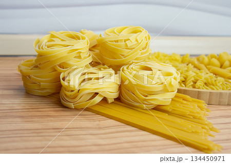 Pasta nests spaghetti scallops, linguini, penne tagliatelle fusilli spirals, 134450971