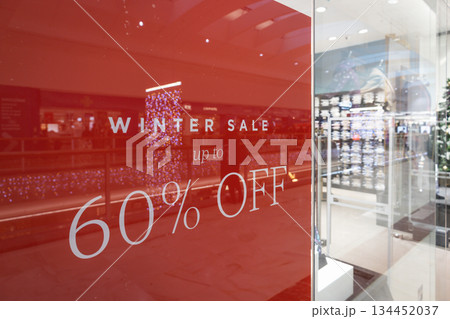 Red Store Window Sign Displaying 60 Percent Off Sale 134452037