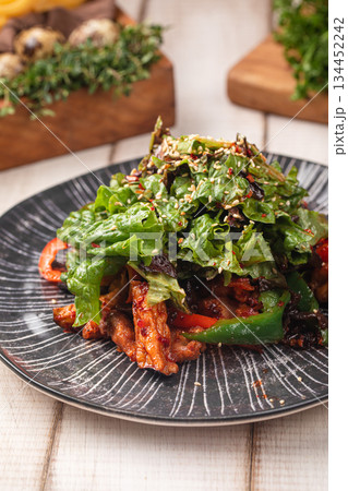 Spicy chicken salad with greens and vegetables Spicy chicken salad with greens and vegetables 134452242
