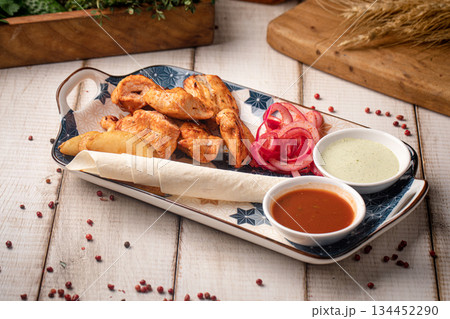 Grilled chicken kebab with dipping sauces Grilled chicken kebab with dipping sauces 134452290