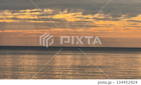 sunset over the sea sunset over the sea 134452924