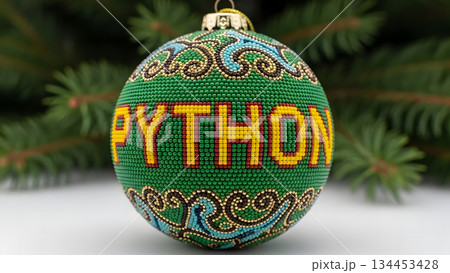 Python programming language Christmas ornament on a festive fir tree branch Python programming language Christmas ornament on a festive fir tree branch 134453428