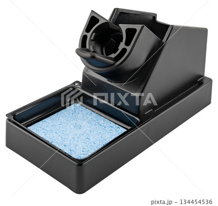 Soldering iron stand in a plastic case on a white background in insulation Soldering iron stand in a plastic case on a white background in insulation 134454536