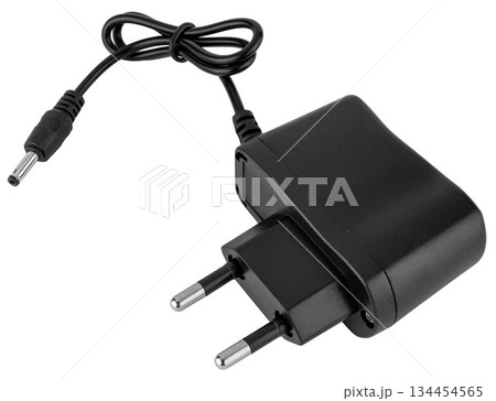 Compact power adapter for stable charging of electronic devices and gadgets. On a white background 134454565