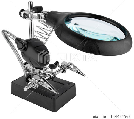 Third hand magnifying glass for repairing electronic components. On a white background in isolation. Third hand magnifying glass for repairing electronic components. On a white background in isolation. 134454568