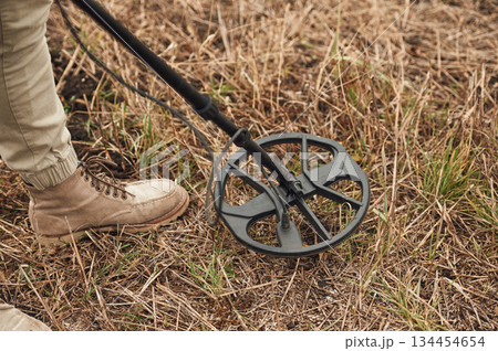Sensitive sensor, searching. Man is with metal detector in the field Sensitive sensor, searching. Man is with metal detector in the field 134454654