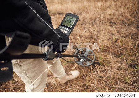 Information on the display. Man is with metal detector in the field Information on the display. Man is with metal detector in the field 134454671
