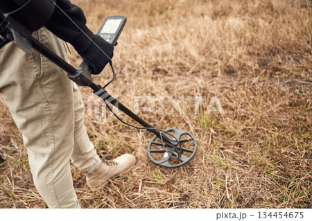 Sensitive sensor, searching. Man is with metal detector in the field Sensitive sensor, searching. Man is with metal detector in the field 134454675