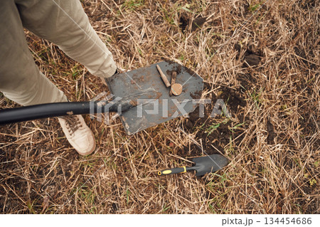 Man found old bullets and coin, sapper, close up view, with shovel Man found old bullets and coin, sapper, close up view, with shovel 134454686