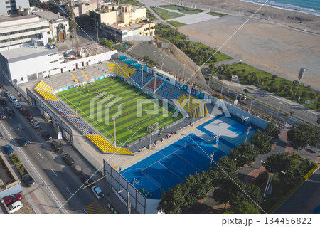 Aerial view sports complex with soccer field along coast 134456822