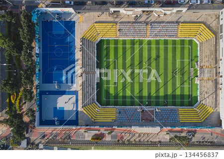 Aerial view urban sports complex with soccer field and basketball courts 134456837