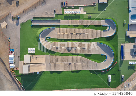 Bmx race track with winding course from aerial view 134456840