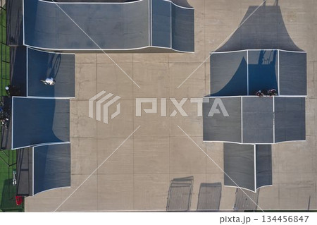 Aerial view of skate park with bmx riders 134456847