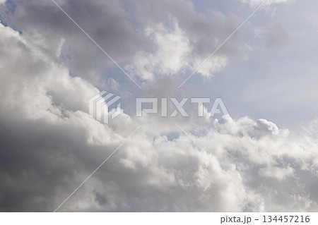 Dynamic Cloudscape with White and Gray Formations. Cloudscape Background. Nature and Climate Concept. High quality photo 134457216