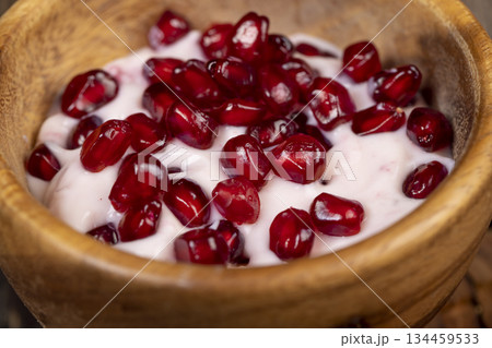 delicious fresh pink yogurt and ripe red pomegranate seeds, delicious pomegranate-flavored yogurt and fresh ripe pomegranate delicious fresh pink yogurt and ripe red pomegranate seeds, delicious pomegranate-flavored yogurt and fresh ripe pomegranate 134459533