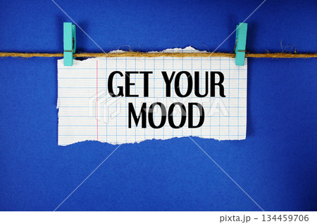 Get Your Mood text written on rip paper with wooden clip on blue background 134459706