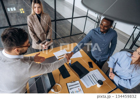 Professional workers are in the modern office together Professional workers are in the modern office together 134459832