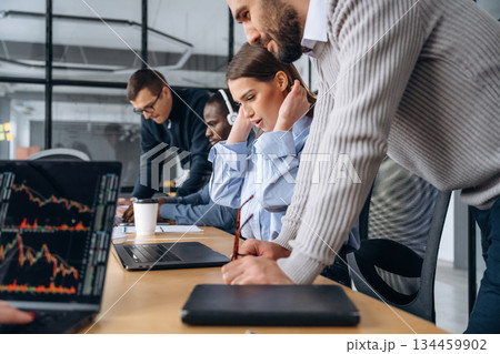 Active discussion and planning. Professional workers are in the modern office together 134459902