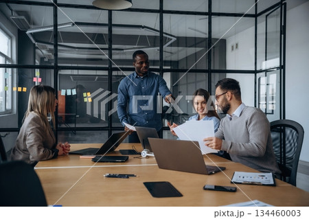 Business conception. Professional workers are in the modern office together 134460003