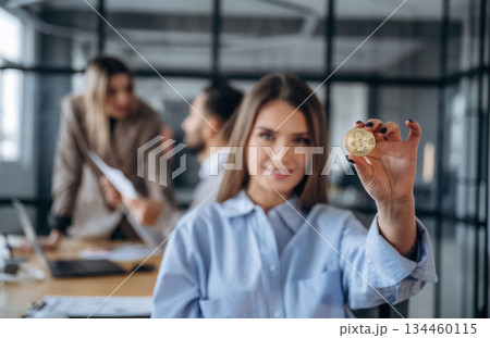 Trading and crypto currency conception. Professional workers are in the modern office together Trading and crypto currency conception. Professional workers are in the modern office together 134460115