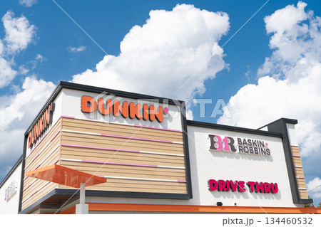 Chicago, USA - August 16, 2024: Combined Dunkin Donuts and Baskin Robbins cafe. . Corner view. best ice cream and donuts 134460532