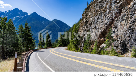 North Cascades nation park. Road leads to Diablo lake with mountain landscape. Landscape of mountain and road. Travel destination. Landscape route to North Cascades National Park. Scenic nature 134460656