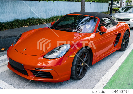 Miami Beach, Florida USA - June 9, 2024: 2018 Porsche 718 Boxter s orange color at miami beach. luxury car porshche at ocean drive Miami beach. front corner view 134460795