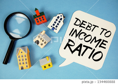 DTI Debt To Income Ratio text with house models on blue background DTI Debt To Income Ratio text with house models on blue background 134460888