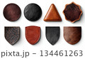 Various leather patches in different colors and shapes arranged neatly on a light background showcasing craftsmanship and material diversity 134461263