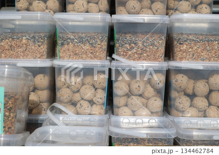 Bird Seed and Feed Balls in Transparent Containers 134462784