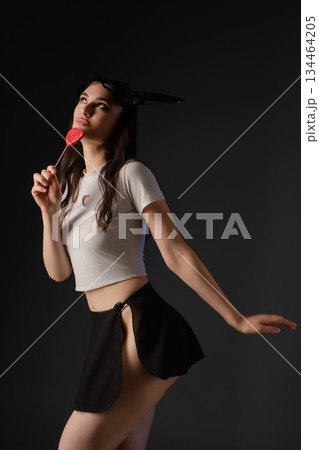 Woman in lingerie gracefully dancing in a modern studio setting 134464205