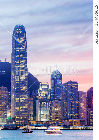 Hong Kong city skyline at sunset with glowing sky and skyscrapers 134465615