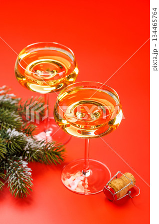 Champagne glasses and snowy fir branches Champagne glasses and snowy fir branches 134465764
