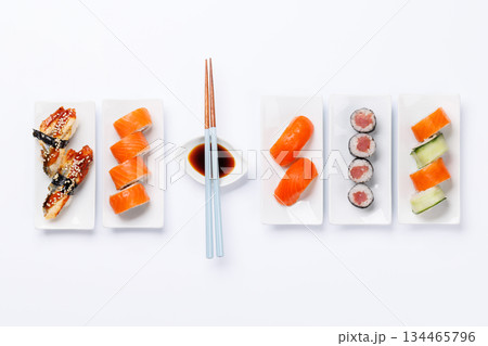 Assorted sushi and maki rolls beautifully arranged on plates Assorted sushi and maki rolls beautifully arranged on plates 134465796