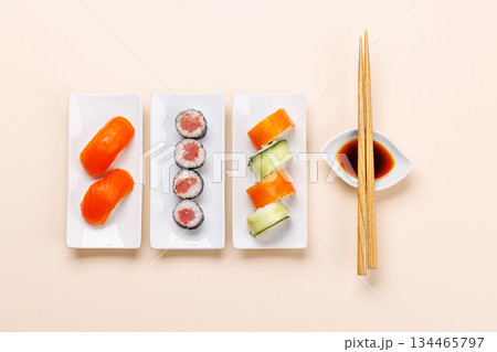 Assorted sushi and maki rolls beautifully arranged on plates 134465797