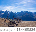 Scuol, Switzerland - October 11th 2025: Two bikes in front of the impressive view from motta naluns biking resort 134465826
