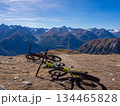 Scuol, Switzerland - October 11th 2025: Two bikes in front of the impressive view from motta naluns biking resort 134465828