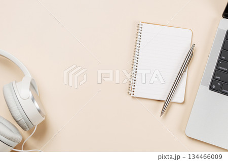 Laptop and stationery on beige workspace, top view with copy space Laptop and stationery on beige workspace, top view with copy space 134466009