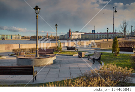 view of the Birzhevoy bridge and Rostral columns at sunset, lampposts on the bridge, Neva River with a view of the arrow of Vasilyevsky Island with rostral columns view of the Birzhevoy bridge and Rostral columns at sunset, lampposts on the bridge, Neva River with a view of the arrow of Vasilyevsky Island with rostral columns 134466845