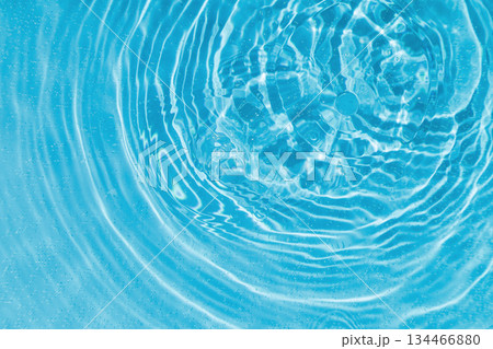 drops on water with circles on a blue background drops on water with circles on a blue background 134466880