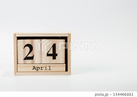 Wooden calendar April 24 on a white background Wooden calendar April 24 on a white background 134466881