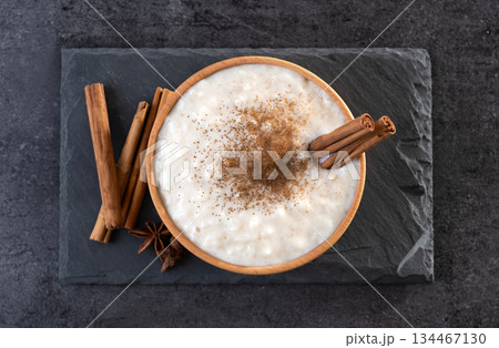 Rice pudding on wooden bowl 134467130