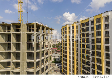 Apartment or office tall concrete building under construction. 134467152