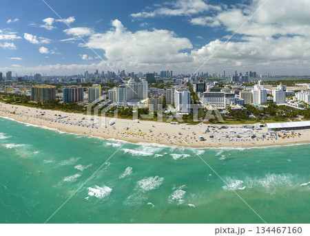 American southern seashore of Miami Beach city. Tourist infrastructure in Florida, USA. South Beach high luxurious hotels and apartment buildings American southern seashore of Miami Beach city. Tourist infrastructure in Florida, USA. South Beach high luxurious hotels and apartment buildings 134467160