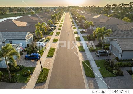 American gated community houses in rural US suburbs. View from above of large residential homes in small town in southwest Florida American gated community houses in rural US suburbs. View from above of large residential homes in small town in southwest Florida 134467161