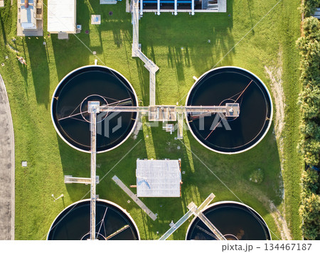 Aerial view of water treatment factory at city wastewater cleaning facility. Purification process of removing undesirable chemicals, suspended solids and gases from contaminated liquid Aerial view of water treatment factory at city wastewater cleaning facility. Purification process of removing undesirable chemicals, suspended solids and gases from contaminated liquid 134467187