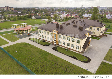 Aerial view of new prescool building in residential rural area. Aerial view of new prescool building in residential rural area. 134467247